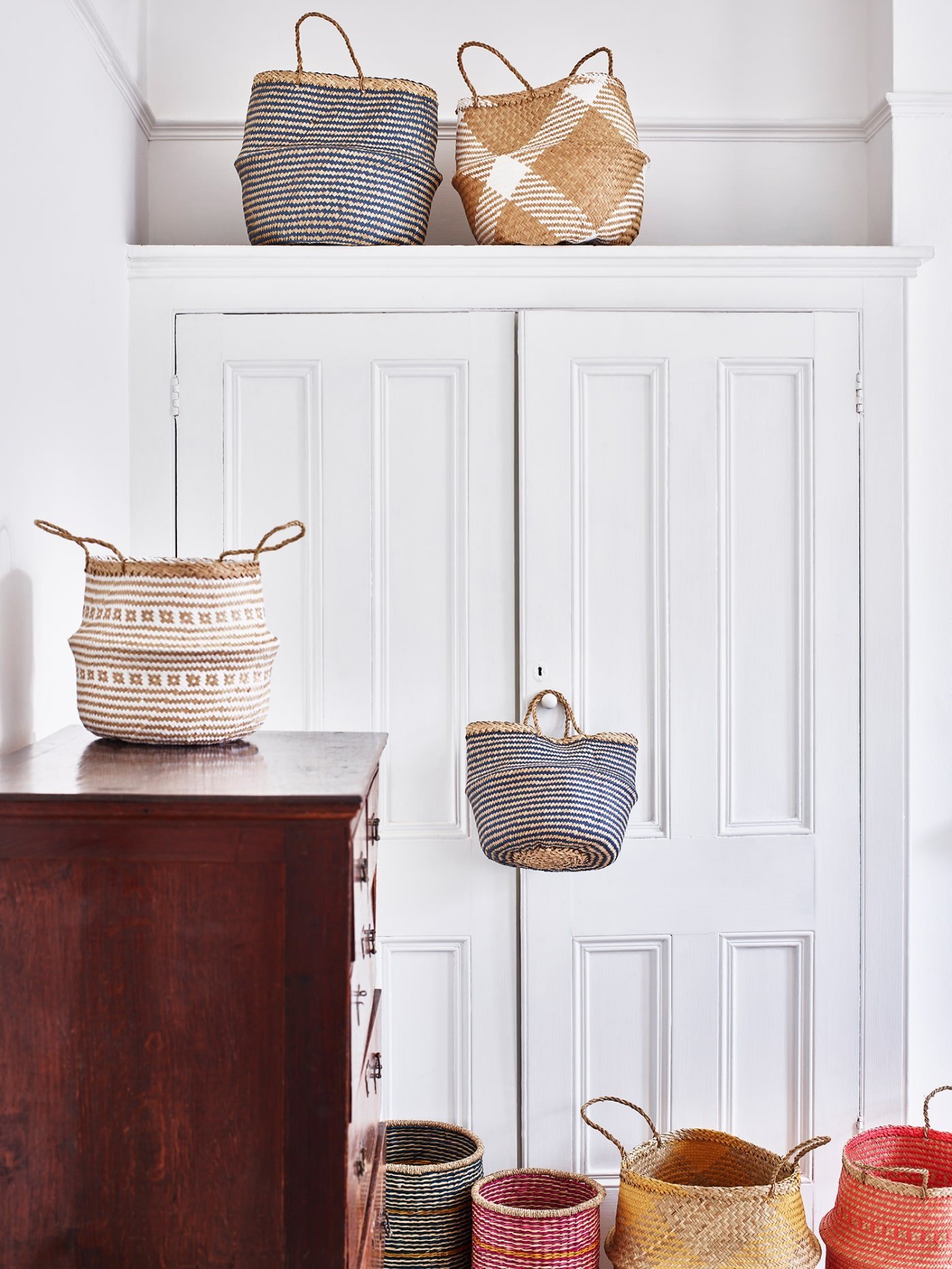 A group of storage baskets in a bedroom