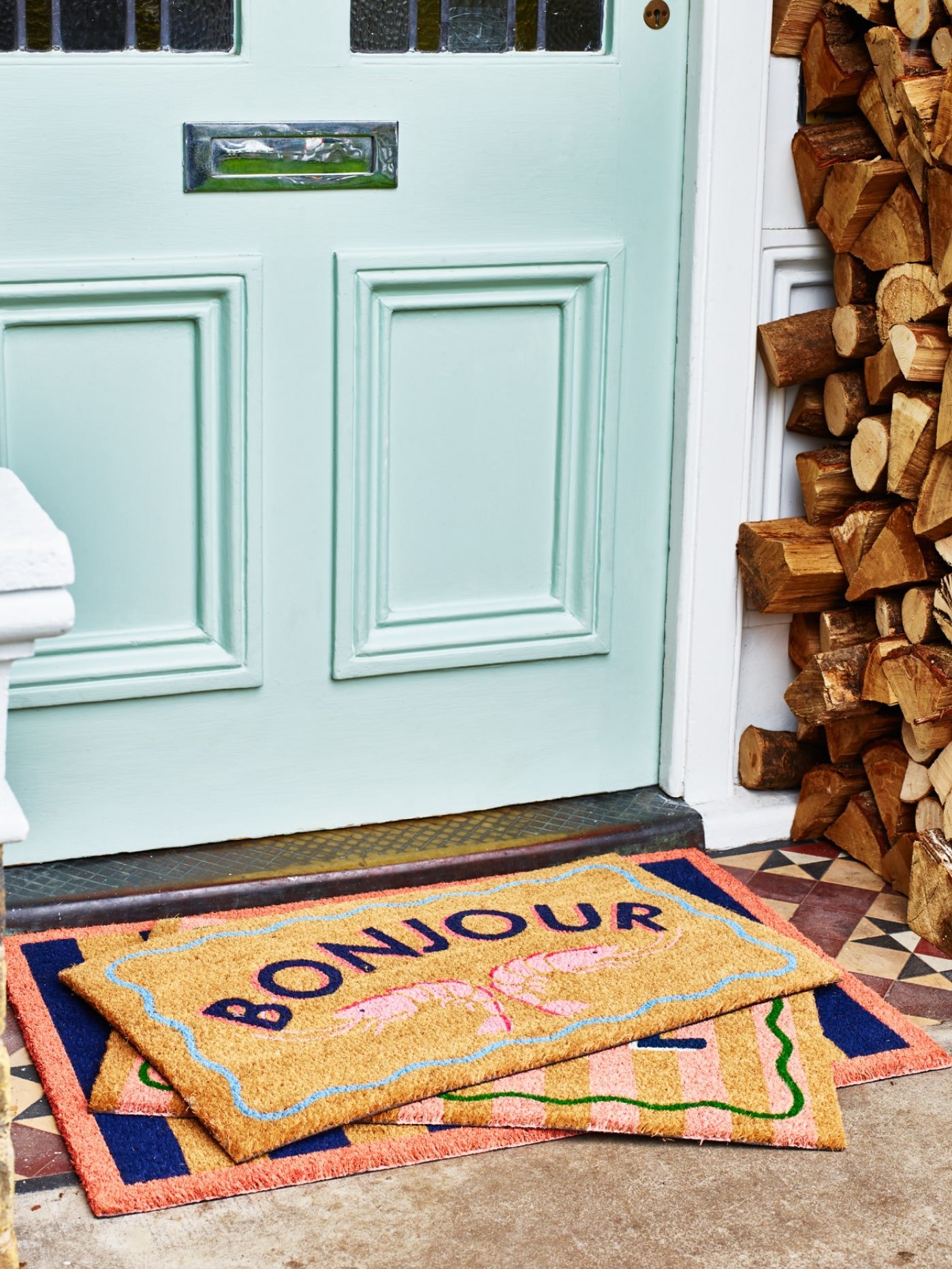 Bonjour doormat on door step in front of door