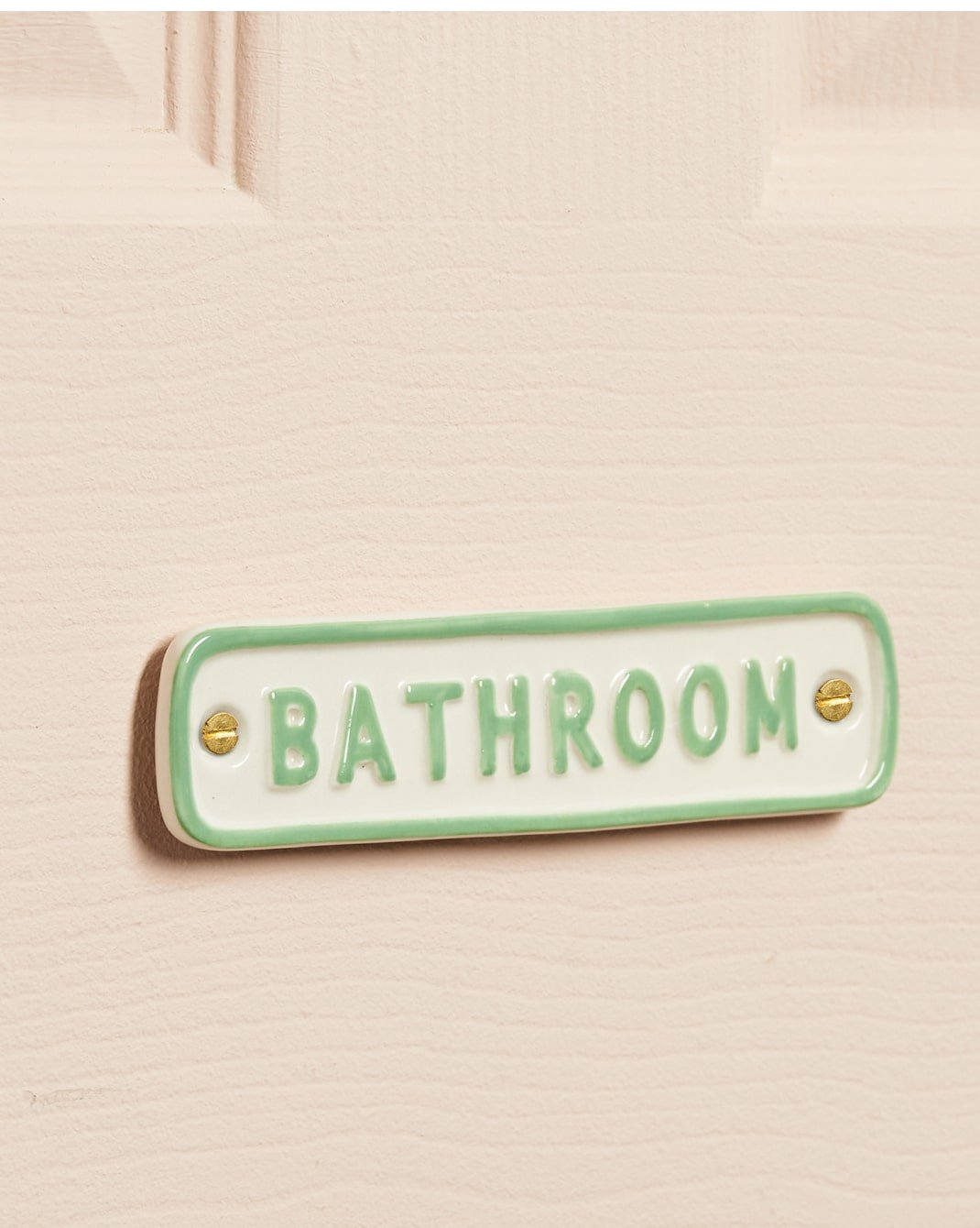 A selection of ceramic bathroom signs