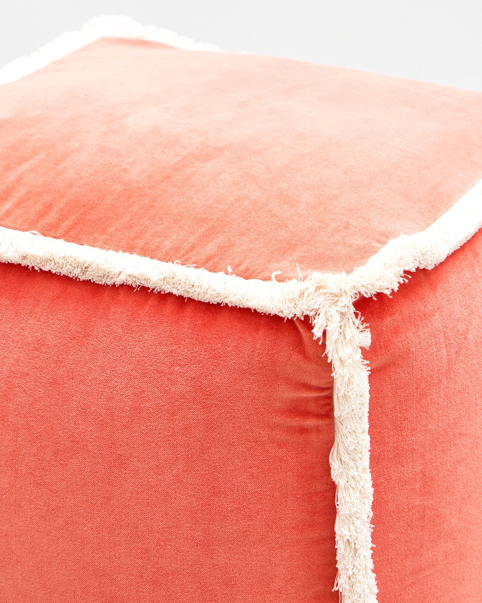 Issey Orange Velvet Fringed Pouffe Footstool | Oliver Bonas