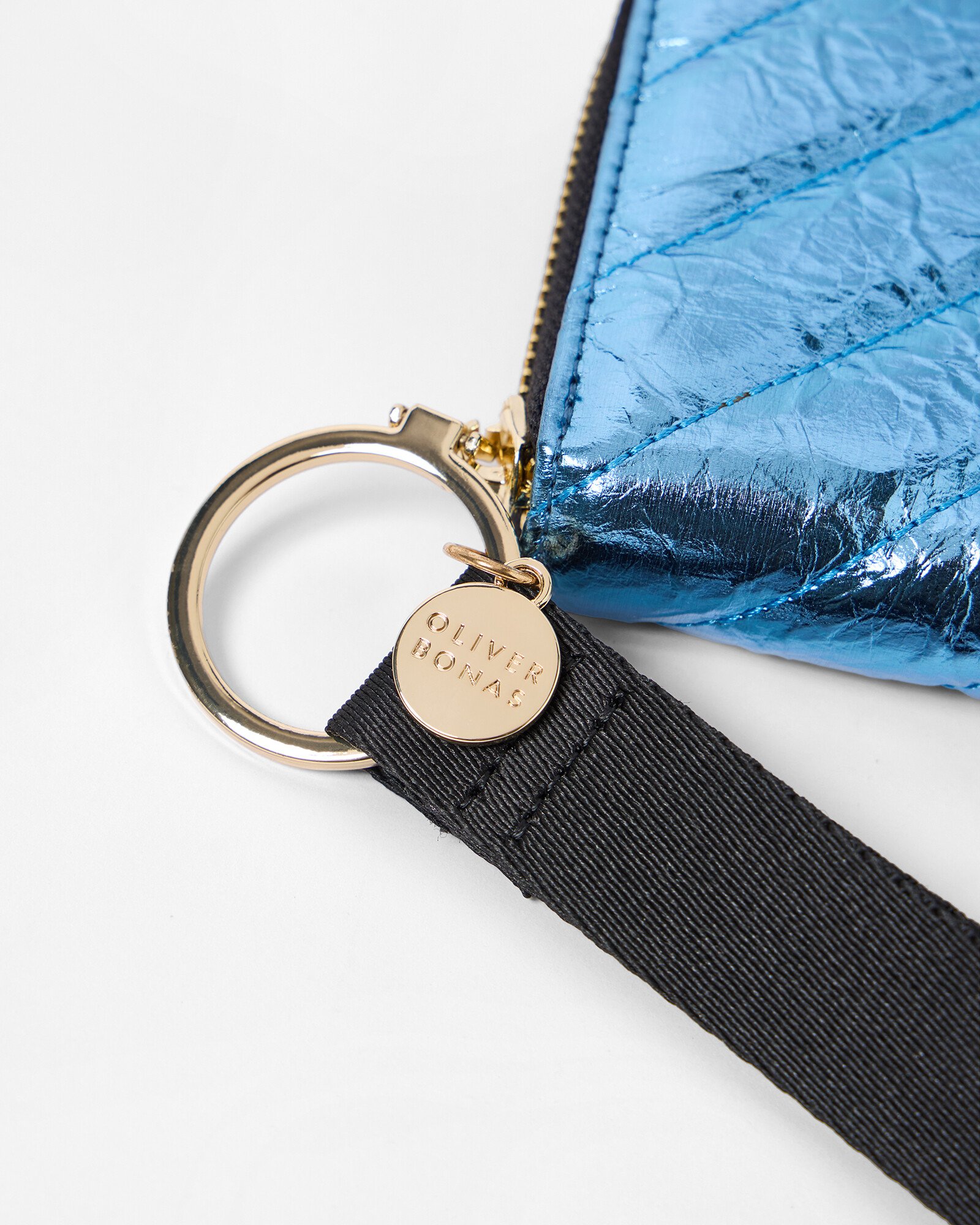 Noah Blue Metallic Quilted Zip Around Purse | Oliver Bonas