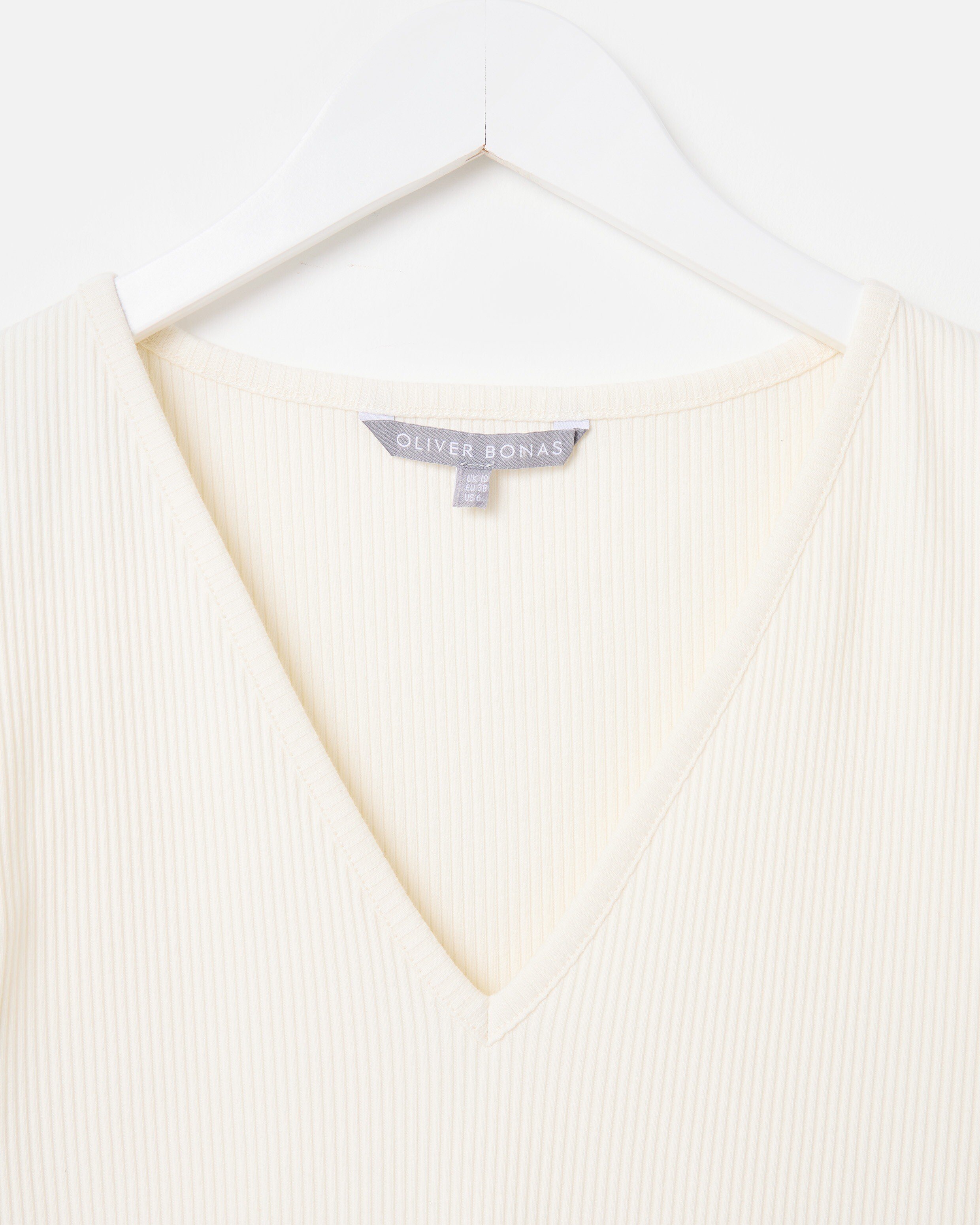Ivory Ribbed V-Neck Frill Sleeve Top | Oliver Bonas