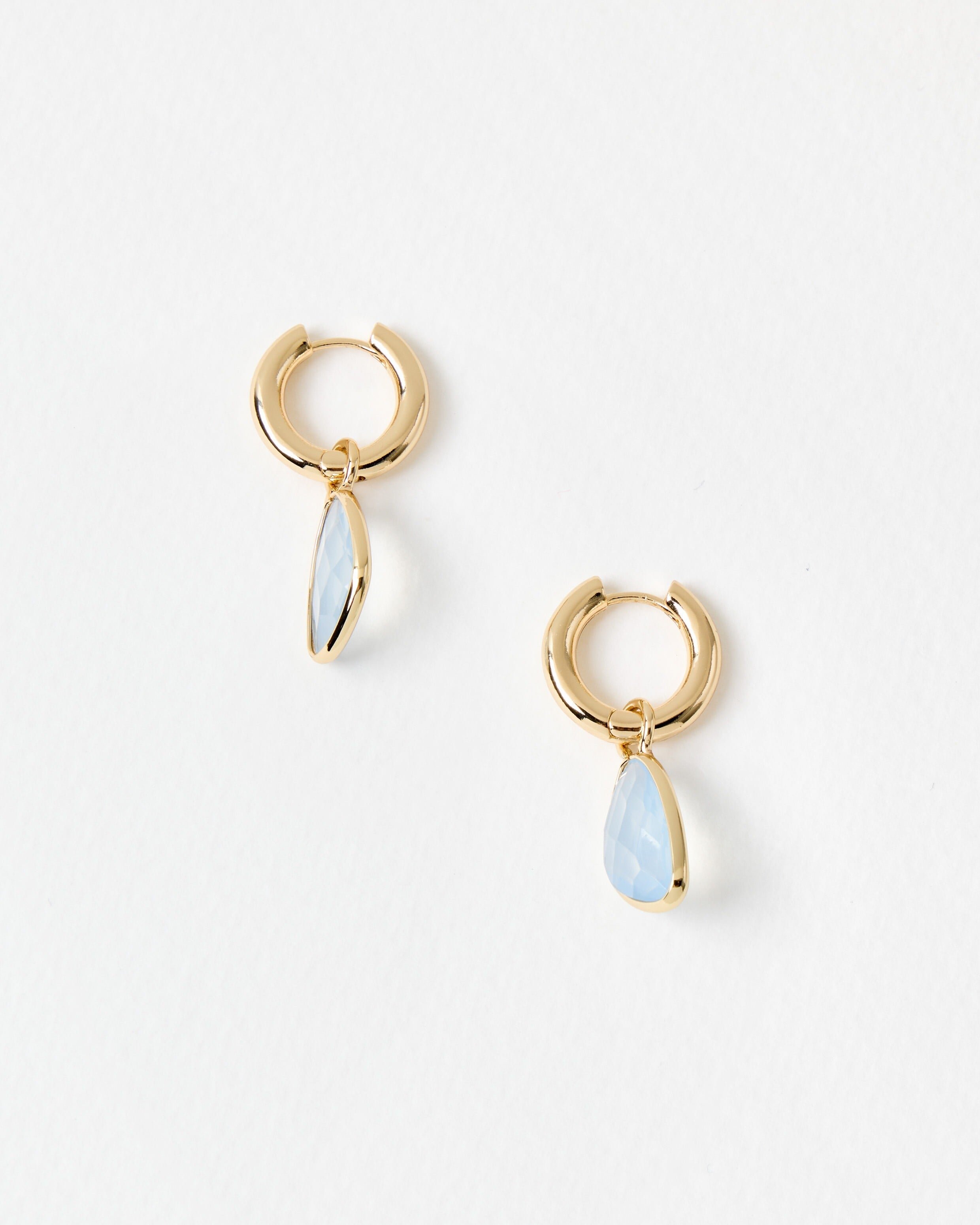 Melody Blue Stone Gold Tone Huggie Earrings