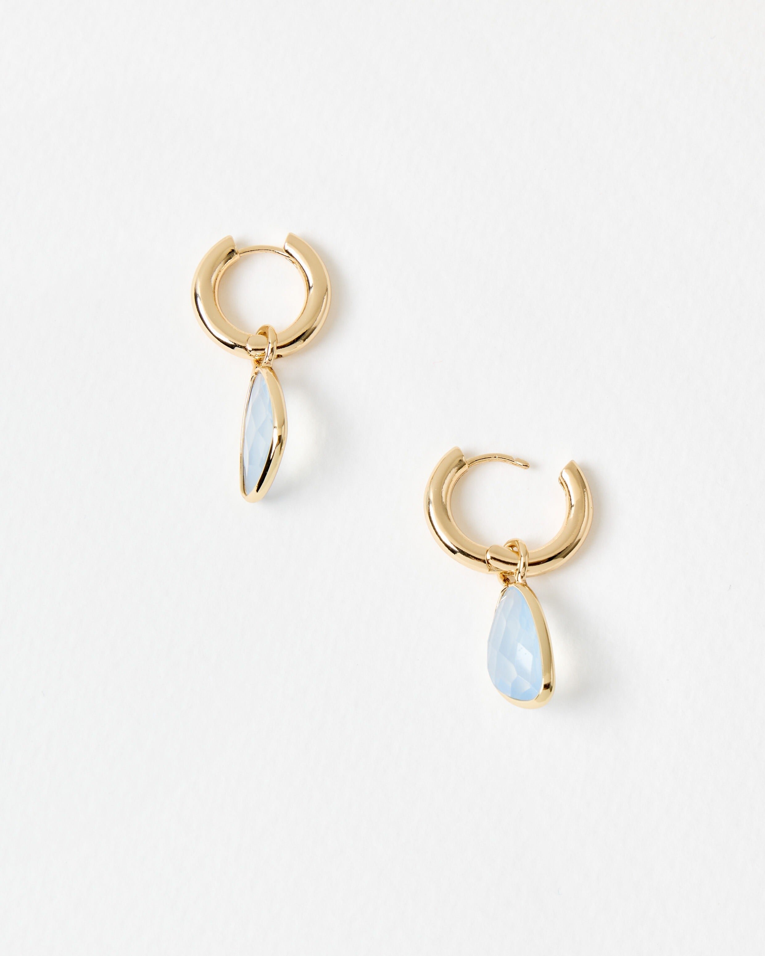 Melody Blue Stone Gold Tone Huggie Earrings