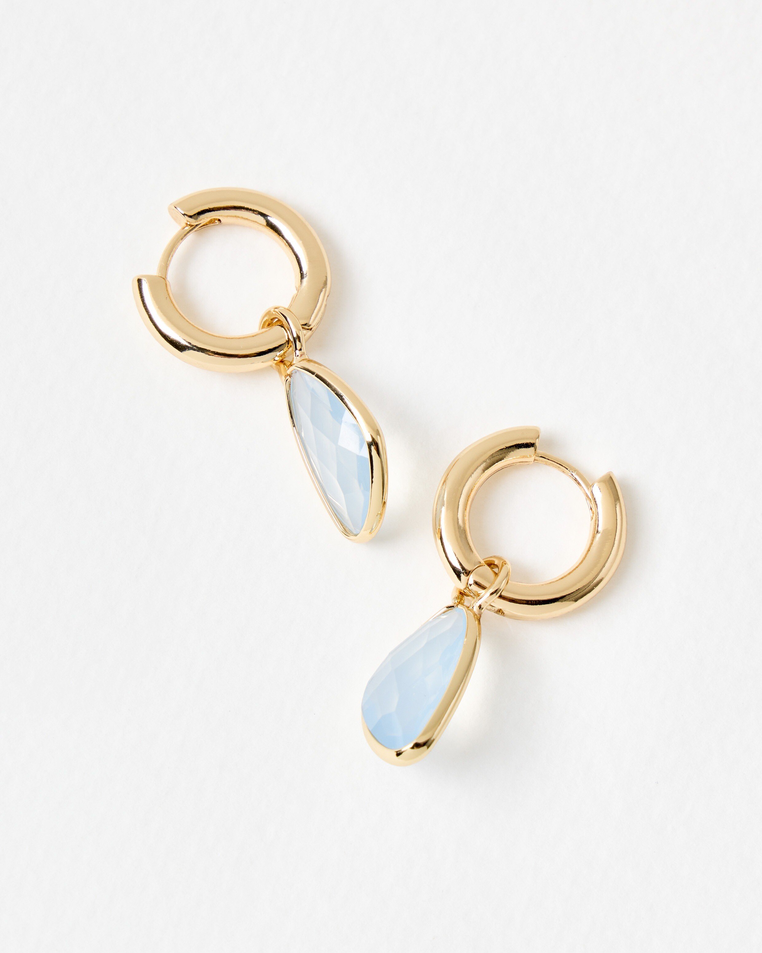 Melody Blue Stone Gold Tone Huggie Earrings