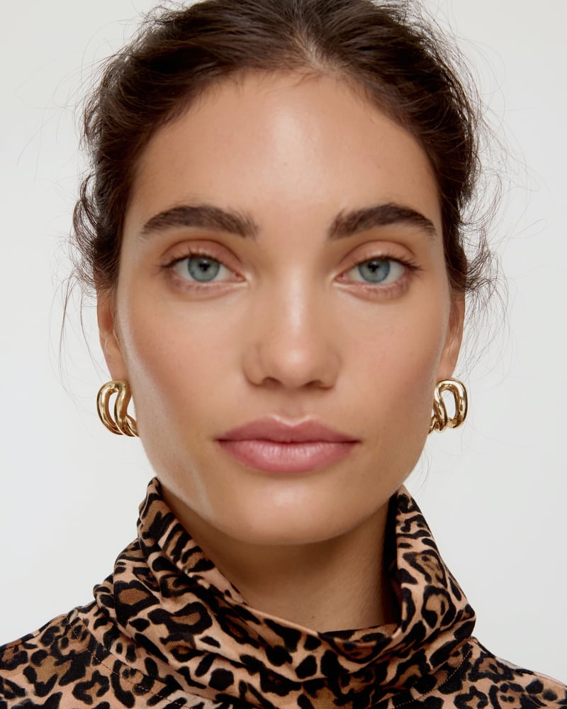 Belvia Curved Loop Gold Tone Hoop Earrings