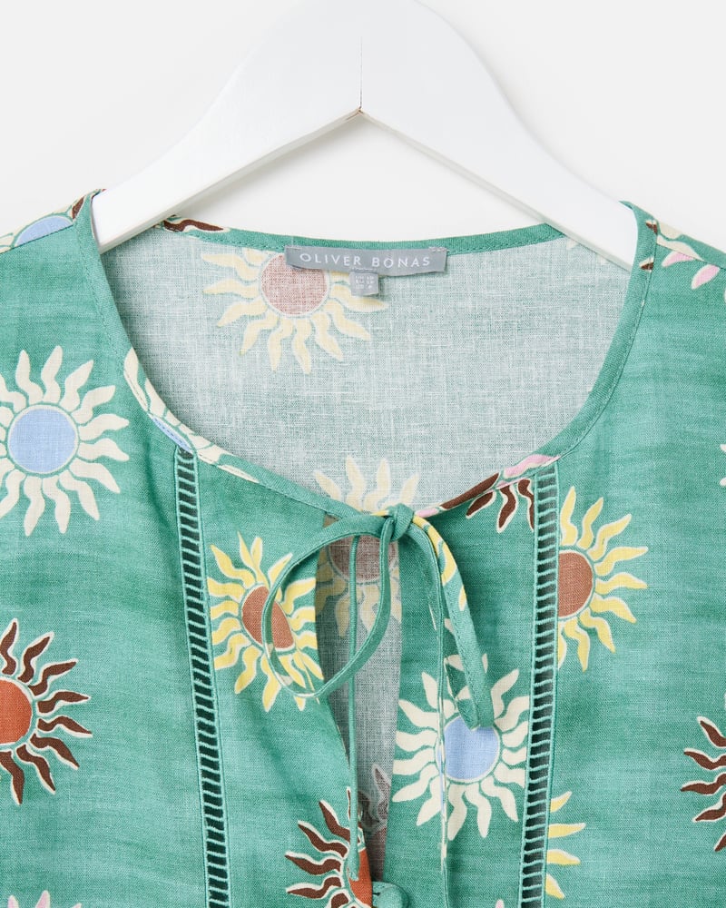 Green Sun Print Sleeveless Peplum Top