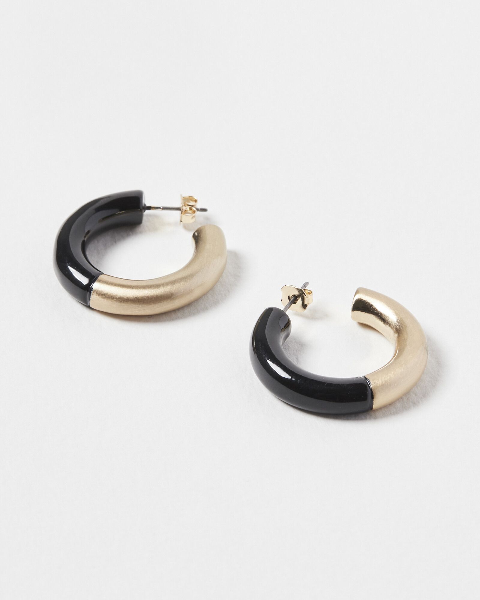 Cleora Half & Half Black Enamel Hoop Earrings | Oliver Bonas