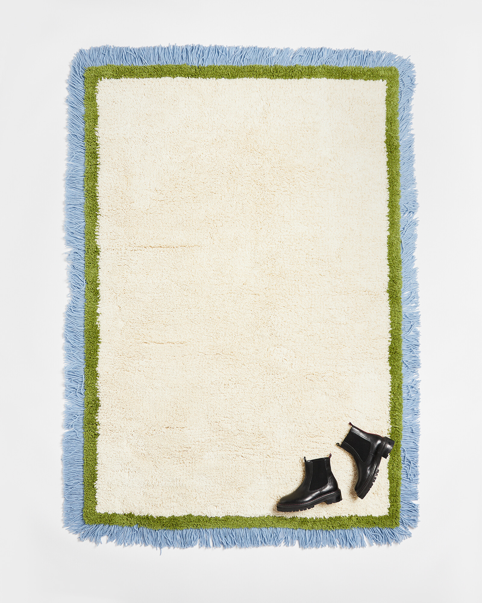 Danton Blue Fringed White Fluffy Rug 200x140cm | Oliver Bonas