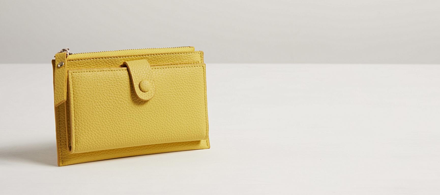oliver bonas yellow purse
